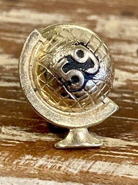 Vintage Gold Tone Globe Lapel Pin with 59 on Black Background